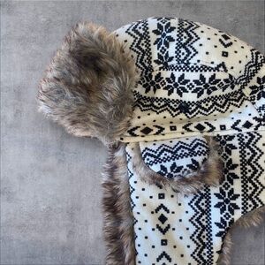 Like new white and black lined faux fur hat